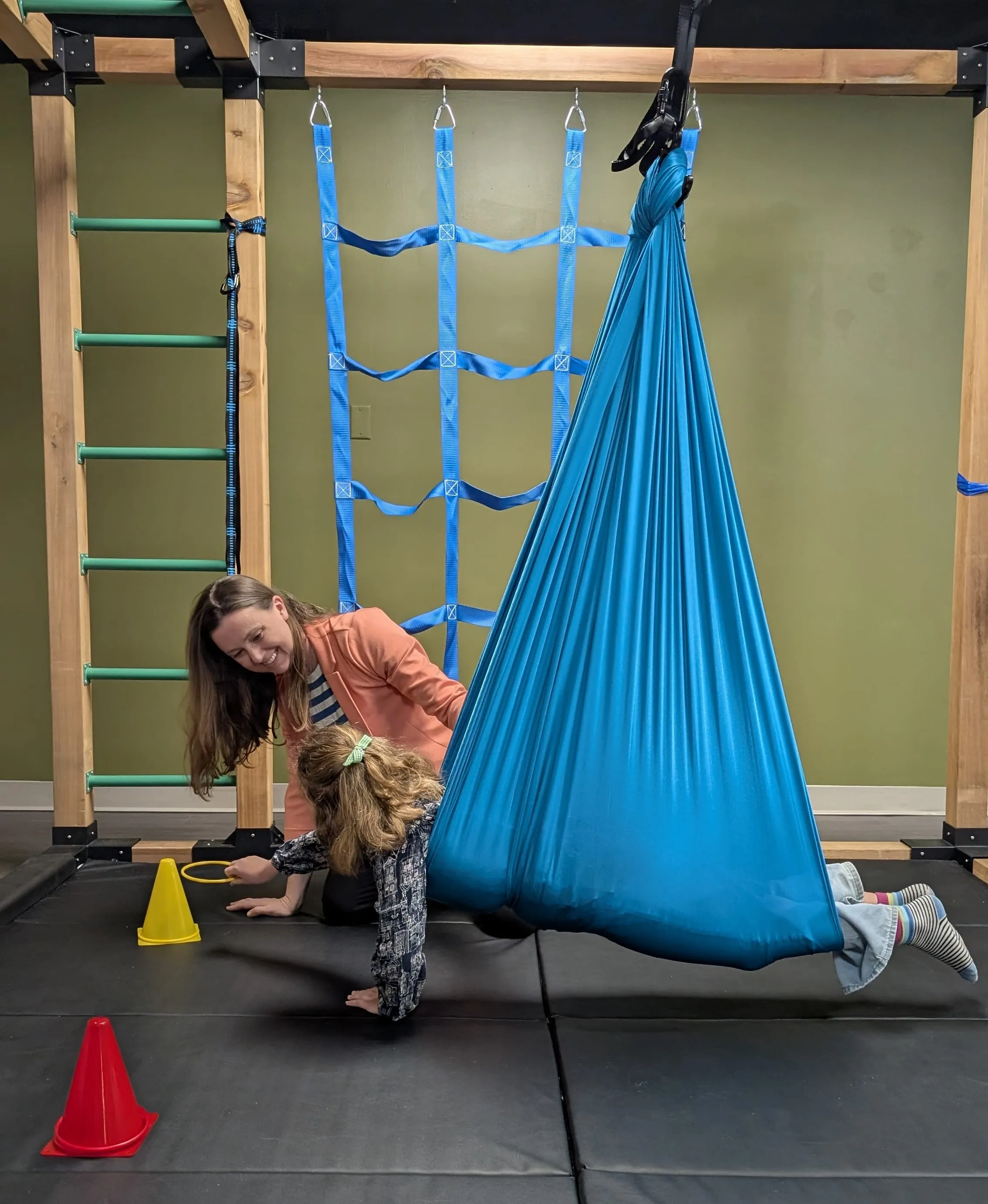 A child working on a bilateral coordination activity