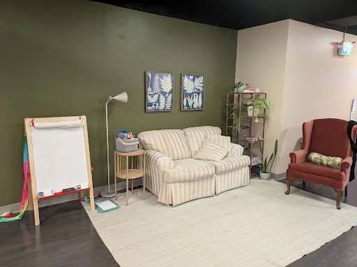 The Burrow's loveseat, armchair, and activity area
