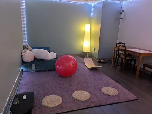 The Burrow's movement space with soft lighting and equipment