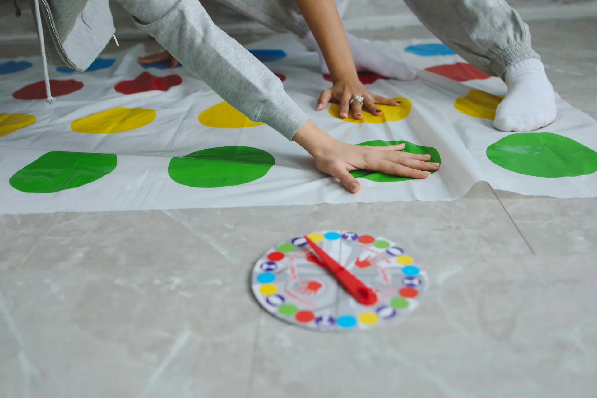 A child and adult play Twister